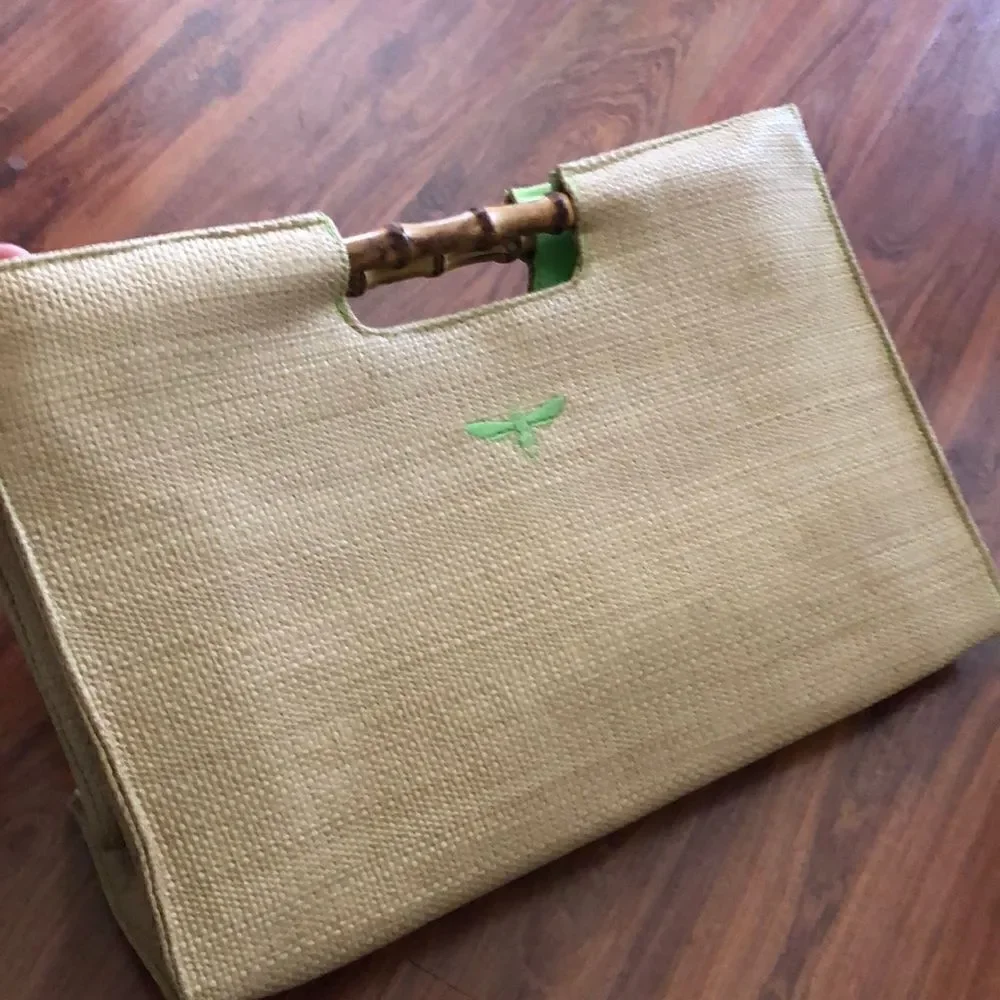 BUZZ by Jane Fox Bamboo handle woven rattan bag.